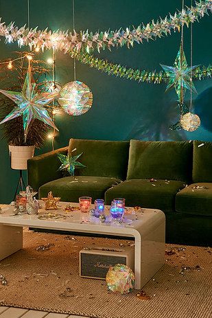 Iridescent foil decorations that give off the right amount of ~shimmer~ throughout the whole year. | 32 Christmas Decorations You'll Want To Keep Up All Year Apartment Party, Iridescent Decor, Mom Cave, Turning 25, Space Grunge, Party Life, Star Decor, 70s Party, Apartment Decoration