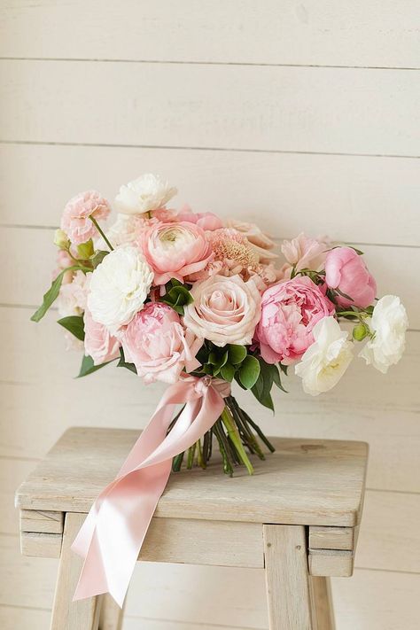 A pink bridal bouquet with peonies, roses, and ranunculus. Bright Pink Bridal Bouquet, Pink Floral Arrangements Wedding, Ranunculus Bouquet Wedding, Peony Pink Wedding, Wedding Bouquet Peonies, Pink And Green Bouquet, Shades Of Pink Wedding, Pink Wedding Florals, Ranunculus Bridal Bouquet