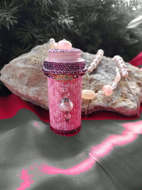 Made with a variety of pink square diamond art beads, glass rhinestones, and thin layer of resin epoxy. With a mixed beaded hanging charm. The lid can be removed and used to hold your goodies that you stash in the bottle. Decorated Pill Bottles, Bedazzled Pill Bottle, Diy Pill Bottle Crafts, Pill Bottles Reuse Craft Ideas, Pill Bottle Art, Glitter Pills, Pill Bottle Crafts, Mint Tin Crafts, Reuse Crafts