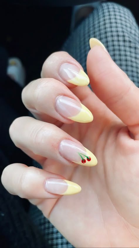 Yellow french tip nails with a lottlw cherry for summer 2023; hailey bieber nails inspiration! Lemon Yellow Nail Art, Hailey Bieber Nails Cherry, Yellow French Nails With Cherry, Yellow French Tip With Cherries, Yellow Nails With Cherries, Hailey Bieber Yellow Nails, Yellow Cherry Nails, French Tip Cherry Nails, Baby Yellow Nails