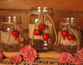 Mason Jars.  Burlap ribbon.  Raffia.  Seasonal Accents:  Cherries, ... Apple Harvest Decor, Apple Decorations For Kitchen, Fall Apple Decor, Decorated Mason Jars, Decor Jars, Apple Kitchen, Apple Decor, Apple Kitchen Decor, Apple Craft