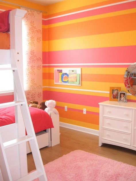 HGTV fan Andi2347 combined bold stripes in orange, pink, yellow and white to create the ultimate girls’ bedroom for two. The sweet color combination helps reflect the natural light, creating a playful yet sophisticated space. Striped Bedroom, Orange Room, Wall Layout, Color Palette Living Room, Girls Room Design, Orange Rooms, Orange Bedroom, Cool Kids Bedrooms, Bedroom Pink