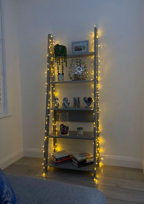 Bookshelf Aesthetic Fairy Lights, Fairy Lights On Bookshelf, Ladder Bookshelf Aesthetic, Bookshelf Fairy Lights, Bookshelf Small Bedroom, Small Shelf Decor Living Room, Fairy Lights Bookshelf, Ladder Decor Bedroom, Ladder Shelf Decor Bedroom