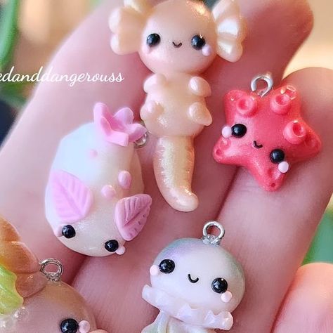 CharmedandDangerous | Handmade Clay Miniatures on Instagram: "New items will be available shortly, along with donut of the month.(7pmcst) Have a wonderful night and weekend, everyone! Thank you for all the love this week on my posts and in dms. I'm so grateful 🩷 #knittingcharms #crochetallthethings  . . . . . . . #knittingfriends #makerscommunity #knittingtools #knittingneeds #makeart #seaslug #jellyfish #axolotl #narwhals" Jelly Fish Clay, Air Dry Clay Miniatures, Clay Jellyfish, Fish Clay, Have A Wonderful Night, Cute Jellyfish, Clay Diy Projects, Sea Slug, Knitting Tools