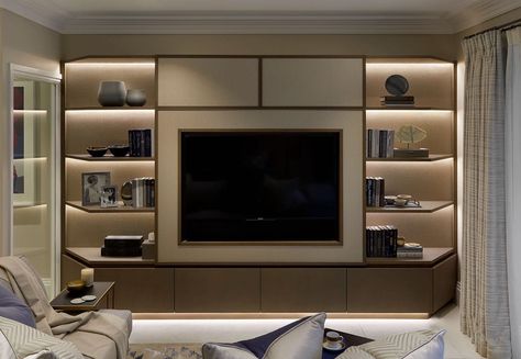 This beautiful design by Laura Hammett manages to make the TV area a beautiful space to be enjoyed instead of simply a TV on a wall. The backlit. shelving on either side add elegance and sophistication Tv Room Inspiration, Tv Joinery, Media Wall With Fireplace, Tv Shelving, Tv Wall Shelves, Laura Hammett, Sophie Paterson Interiors, Built In Entertainment Center, Living Room Wall Units