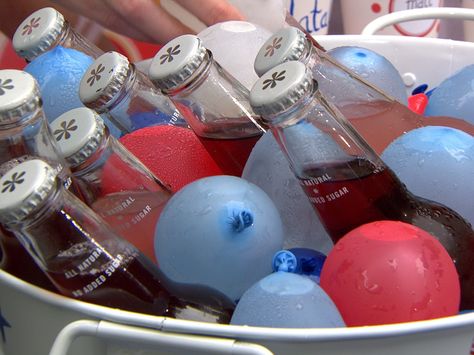 Independence Day comes midweek this year making it a little tougher to get your party planned, but Martha Stewart is here to help. She shows off some last-minute décor and food ideas to make your party festive. July 4 Party, Frozen Water Balloons, Drink Bucket, Happy Birthday America, July Ideas, July Birthday, Patriotic Party, Water Balloons, 4th Of July Decorations