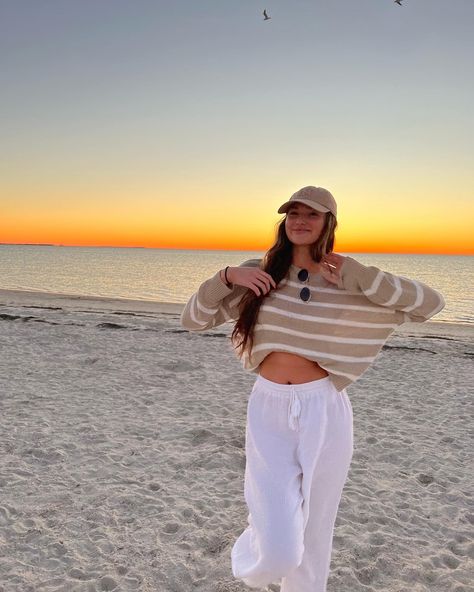 beach outfit, tan striped sweater, white beach pants Sunset Outfits Beach Comfy, Cute Beach Outfits Cold Weather, Comfy Beach Outfit Winter, Covered Beach Outfit, 60 Degree Beach Outfit, Beach Trip Outfits Casual, Chilly Beach Day Outfit Casual, Cold Beach Sunset Outfit, Beach Cleanup Outfit