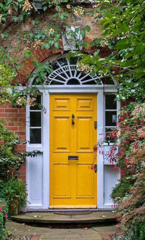 Embrace Sunshine Vibes with a Vibrant Yellow Front Door Yellow Door Aesthetic, Yellow Entrance Door, White House With Yellow Door, Yellow Front Door Red Brick House, Yellow Front Door White House, Yellow Door Exterior, Mustard Yellow Front Door, House With Yellow Door, Colored Front Door