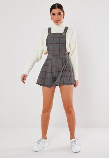 a romper in a pinafore style featuring an all over plaid print design and mock horn button detail. Cord Pinafore Dress, Freshers Week, Week Outfits, Knitted Jumper Dress, Hot Jumpsuits, Black Playsuit, Uni Outfits, Tartan Dress, Kids Collection