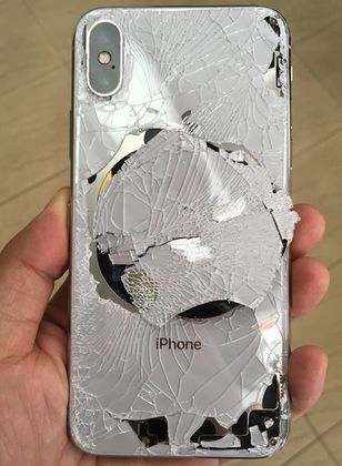 Back glass of an Apple iPhone X is shattered after the phone was dropped Iphone Screen Repair, Iphone Battery, Iphone Repair, Apple Phone Case, Mobile Phone Repair, Iphone Hacks, Apple Iphone 5, Iphone Screen, Asus Zenfone