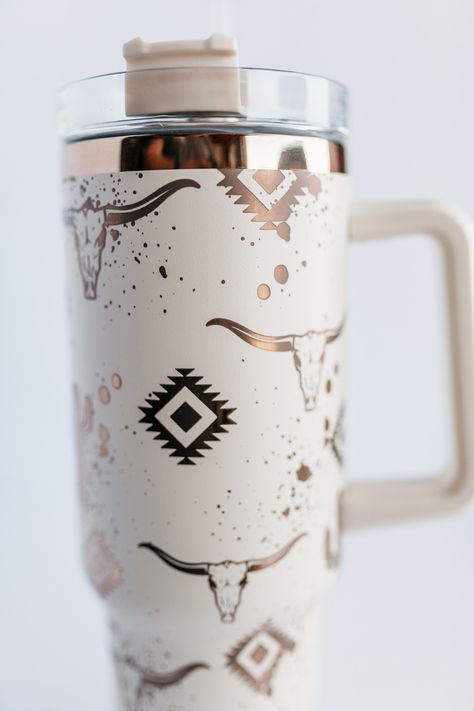 The Viral Tik Tok South Western Aztec design on the 40oz tumbler of your choice.  Aztec, Bull Skull, Cacti, Paint Splatters. Your choice of a white or black 40oz tumbler with rainbow engraving underneath, or Cream with Copper engraving.  Your choice of Tumbler - Black or White both engrave with the Rainbow showing through. You can also chose Cream with the Copper that shows through the engraving. All cups include a lid & straw. Free Shipping is included in all my listings. Quantities of these cups are limited, only available while supplies last.   All cups are laser engraved on a C02 Laser.   Full Wrap Designs take 45-60 Minutes for one cup on the laser. Tumbler Engraving Ideas, Country Tumbler Cups, 40 Oz Tumbler Ideas, Engraved Tumbler Ideas, Hydration Aesthetic, Western Cups, Cowhide Wedding, Aztec Tumbler, Trendy Water Bottles