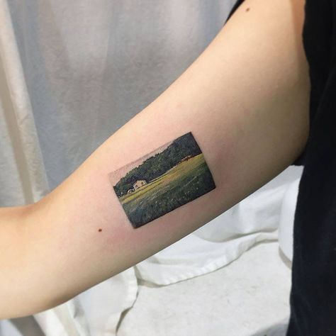 Painting-like countryside landscape tattoo by Muha Lee Teacher Tattoos, Lotr Tattoo, Green Tattoos, Super Tattoo, Handpoke Tattoo, Landscape Tattoo, Geniale Tattoos, Detailed Tattoo, Countryside Landscape