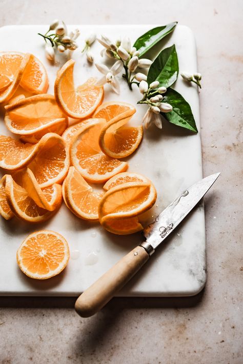 twisted orange slices & fresh orange blossoms - the most beautiful garnish for orange cake #orange #oranges #citrus Aesthetic Orange Photos, Orange Cake Photography, Citrus Aesthetic, Orange Fruit Aesthetic, Orange Aesthetic Fruit, Oranges Fruit Aesthetic, Mandarin Orange Photography, Orange Photography Fruit, Yogurt Frosting