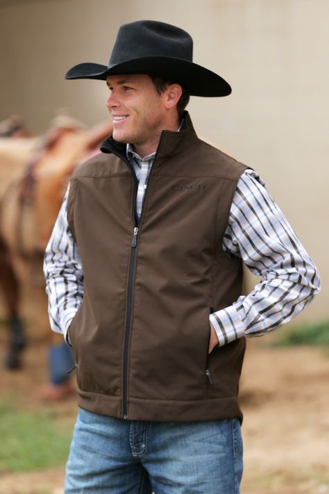 Warm it up, cowboy. You'll get warmth and ease of movement with this men's bonded vest by Cinch. Featuring embroidered logos, zip front, roomy zip pockets and concealed carry pockets with a hook & loo Brown Vest Outfit, Western Fashion Men, Men Vest Outfits, Cowboy Outfit For Men, Vest Outfits Men, Cowboy Outfit, Mens Western Wear, Cowboy Images, Mens Vest Fashion