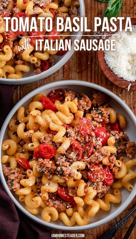 Two bowls filled with pasta rest on a wooden surface with a bowl of parmesan for topping, resting off to the side. Pasta With Italian Sausage, Ranch Dressing Recipe Homemade, Fresh Tomato Pasta, Sausage Ingredients, Spaghetti Salad, Fresh Tomato Recipes, Italian Sausage Pasta, Tomato Basil Pasta, Cherry Tomato Pasta