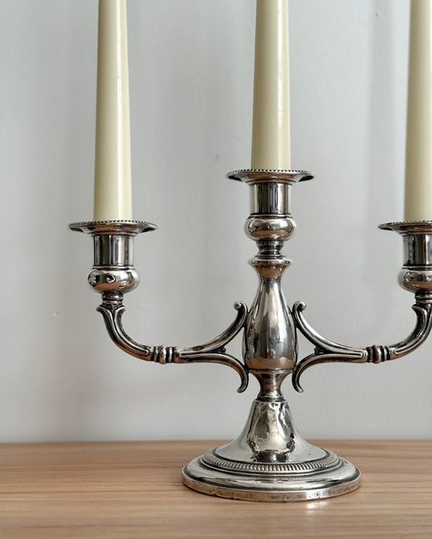 This Vintage Sterling Silver Candle Holder, made by Fisher, is a timeless piece that can bring a touch of elegance to any setting. We’ve carefully cleaned off the patina and polished it, so it now shines with a lovely luster. There are a few small dents from previous use, which give it character and a bit of history. It’s a charming piece that’s ready to be enjoyed and admired in its new home. Dimensions: Height 7” Width 9.5” #vintagesilver #sterlingsilver #fishercandleholder #antiquec... Vintage Silver Candle Holders, Artifacts For Home Decor, Silver Candle Holders, Silver Candle, Vintage Candle, Vintage Candle Holders, Vintage Sterling Silver, Vintage Silver, Candle Holder