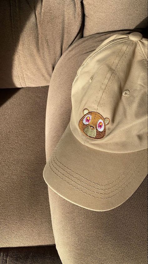 Kanye west ye cap bear college dropout fashion graduation khaki Kanye West Clothes, Graduation Bear Kanye, Kanye West Hat, Kanye West Clothing Line, Kanye Merch, Kanye Bear, Kanye West Bear, Kanye West Wallpaper, Graduation Bear