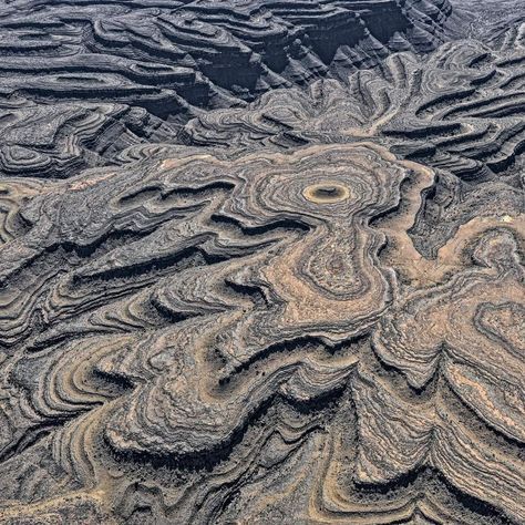 Aerial photo of the Huns Mountains, Namibia. Deep canyons cut into this old desert mountain range. Its rock layers were deposited in an ancient ocean 500 Million years ago. The hard limestone shelves erode more slowly than the softer intervening marlstone strata, causing the sides of the valleys to break into terraces.⁣. Photo shared by Bernhard Edmaier Photography. The Huns, Rock Layers, Art Muse, Rock Textures, Desert Mountains, Natural Structures, Muse Art, Aerial Photo, Mountain Range