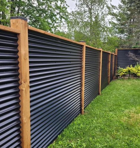 Black Galvanized Fence, 1 Acre Privacy Fence, Yard Fence Ideas Outdoor Privacy, Mountain Home Fence Ideas, Black Wooden Privacy Fence, Black Metal And Wood Fence, Sheet Metal Privacy Fence Ideas, Tin Privacy Fence Ideas, Coragated Fence Ideas