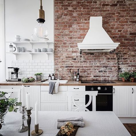 Kitchen Ideas With Brick, Brick Accent Wall Kitchen, Beige Countertops, White Cabinets Wood Countertops, Accent Wall Kitchen, Modern Kitchen Design Trends, Brick Wall Kitchen, Brick Accent Wall, Brown Floor