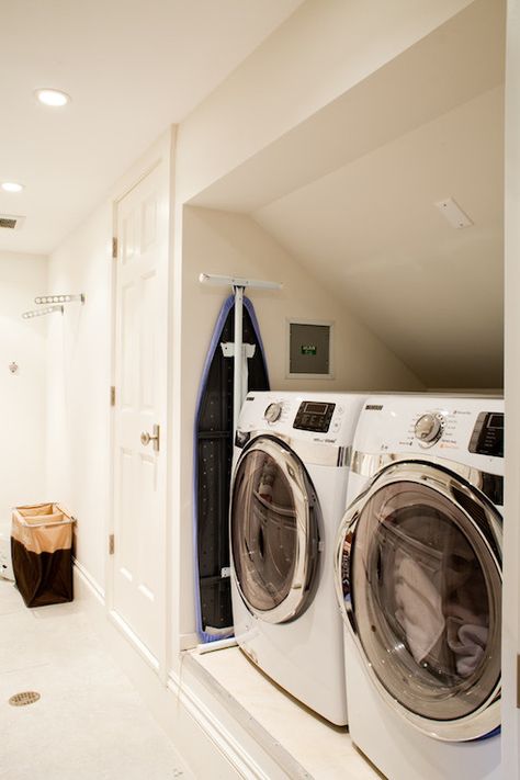 Lovely laundry room features front-load washer and dryer in small nook. Small Washer And Dryer, Compact Laundry Room, Contemporary Laundry Room, Laundry Room Design Ideas, Transitional Laundry Room, Traditional Laundry Room, Laundry Nook, White Laundry Rooms, Basement Laundry Room