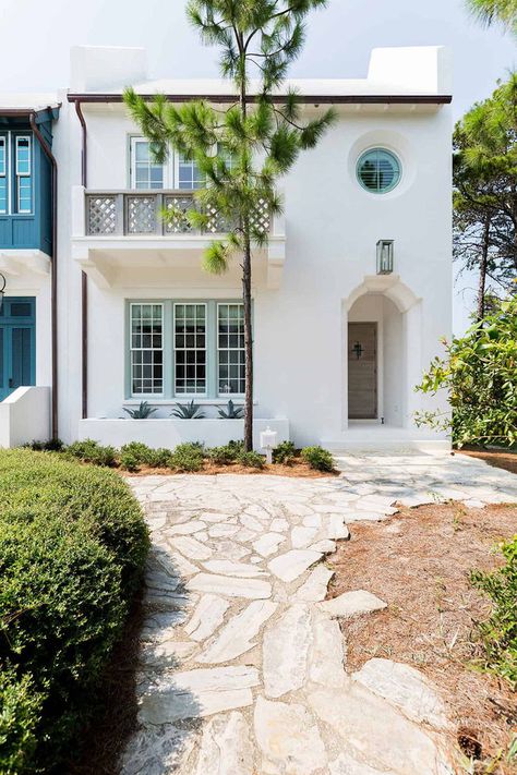 Domin Bock Architects in collaboration with Urban Grace Interiors has created this modern beach house for a family of four, located on Alys Beach, Florida. The goal of this project was for the design to have an open layout, be functional and live well. Windows were added to the north side of the house to maximize natural light. Colorful Beach House Exterior, 30a Architecture, Lisa Beach, Spanish Beach House, Alys Beach Florida, House Minimalist, Coastal Exterior, Beach House Tour, California Architecture