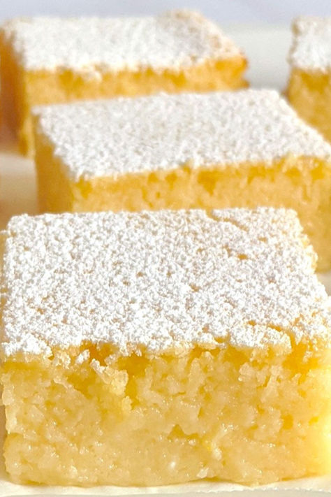 We call these lemon bars 'impossible' because they are so easy to make. You mix all the ingredients together and pour into a pan. Once baked, it's important to set them aside in the pan for an hour or two before placing in the fridge for a further one hour. This will help firm them up and make them much easier to cut. Easy Lemon Bars Recipe, Recipes With Lemons Easy, Citrus Desserts Easy, Lemon Deserts Ideas Easy, Lemon Pie Recipe Condensed Milk, Easy Lemon Desserts, Lemon Cobbler, Lemon Ideas, Lemon Recipes Easy