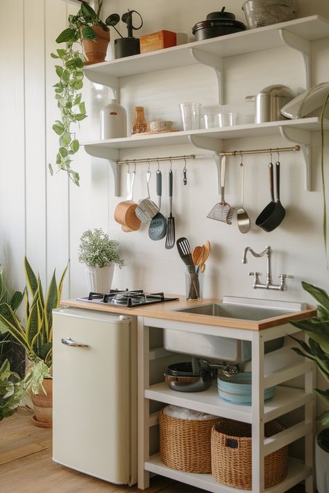 tiny house kitchen with shelves and hanging utensils Tiny Home Kitchenette, Very Small Kitchen Ideas Tiny Houses, Attic Kitchenette, Tiny Kitchen Layout, Studio Kitchen Ideas, Mini Kitchen Ideas Small Spaces, Tiny Home Decorating Ideas, Tiny Home Kitchen Ideas, Tiny Home Storage Ideas