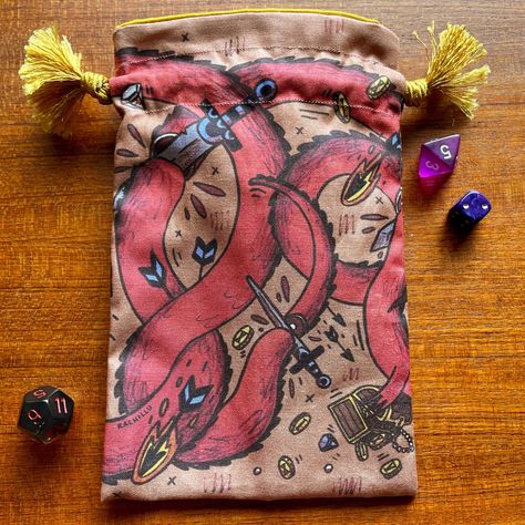 My two dice bags! Have just ordered in some more fabric to make more of the blue ones 🧵 Which do you like best? I have a love hate relationship with the dragon one because I love how it looks but it's so darn fiddly matching up the image at the seams 🐲 #dicebag #dicebags #dnd5e #dnddicebag #polyhedraldice #dicegoblin #etsyshopping #etsyselleruk #dragondicebag #ttrpgdice #dndcrafts #handmadedicebag Dnd Dice Bag, Dnd Crafts, Dice Bags, Dragon Dies, Polyhedral Dice, Dice Bag, Illustration Work, Dnd Dice, The Dragon