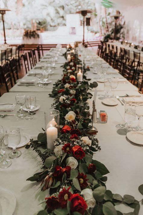 Winter Wedding With Red Accents, Winter Wedding Centerpieces Rectangle Table, Deep Red And White Wedding, Candle Decorations For Wedding, Black White Red Green Wedding, Christmas Arch Wedding, Red And Green Table Decor, Red White Green Floral Centerpieces, Winter Wedding Red And White