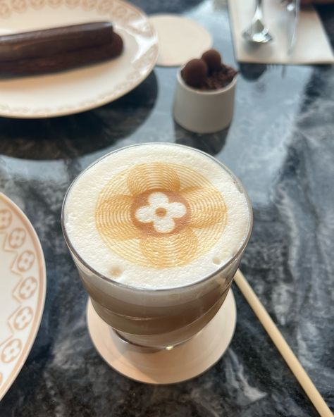 Hazelnut Latte at the Louis Vuitton Cafe in Paris! #louisvuitton #paris #LV #louisvuittoncafe #pariscafe #luxury #designer #coffee #latte #hazelnutlatte #luxuryliving #parisfrance Louis Vuitton Cafe, Cafe In Paris, Louis Vuitton Paris, Designer Coffee, Paris Cafe, Coffee Latte, Hazelnut, Luxury Designer, Paris France