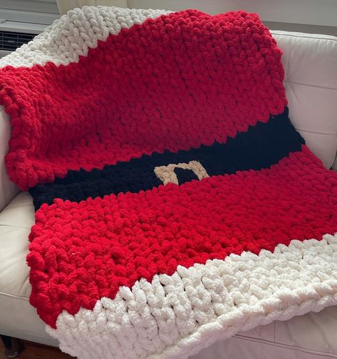 "Chunky knitted Santa blanket  Chunky knitted Christmas blanket  This Christmas Santa blanket is perfect for decor or even a gift! The pictures included are a lap throw size All orders are handmade If there is any personalization you would like to include, please feel free to message me! I will try my best to accommodate you *I do not accept returns or exchanges all sales are final* Please note: Processing time will differ depending on the size of the blanket ESTIMATED PROCESSING TIME Baby:3-5 business days Throw: 4-6 business days Twin: 5-7 business days Full: 6-8 business days Queen: 6-8 business days King: 7-10 business days DIMENSIONS: Baby: 28\" x 28\" Lap throw 30\" x 50\" Standard Throw 40\" x 60\" XL Throw: 50\" x 60\" Twin: 39\" x 75\" Full: 54\" x 75\" Queen: 60\" x 80\" King: 76 Santa Blanket, Crochet Patchwork Blanket, Chunky Blanket Diy, Chunky Knit Blanket Pattern, Knitted Santa, Chunky Yarn Blanket, Chunky Blankets, Chunky Crochet Blanket Pattern, Yarn Blanket