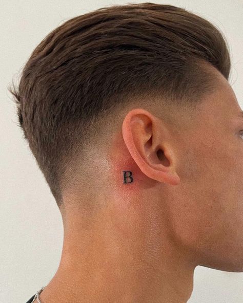 Letter tattoo behind ear / font Initials Tattoo Behind Ear, Small Initial Tattoo Behind Ear, R Tattoo Behind Ear, Letter Ear Tattoo, Neck Initial Tattoo, Capital B Tattoo, Small Letter Tattoo Behind Ear, Behind The Ear Letter Tattoo, The Letter B Tattoo