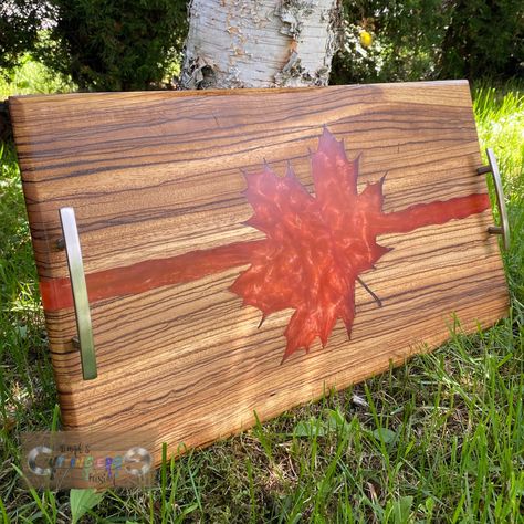 Zebrawood and resin. Black diamond pigments.  #handmade #charcuterie #cuttingboard #servingtray #kitchen #epoxy #mapleleaf #leaf #blackdiamondpigments #zebrawood Epoxy Charcuterie Board, Resin Boards, Resin And Wood Diy, Wood Resin Table, Resin Table Top, Aluminum Can Crafts, Stabilized Wood, Diy Resin Projects, Wood Shop Projects