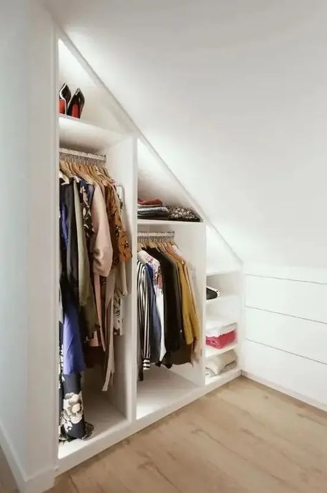 Picture of a minimalist closet Slanted Wardrobe Ideas, Angled Wardrobe Ideas, Attic Walk In Wardrobe, Slanted Walk In Closet, Attic Closet Ideas Angled Ceilings Diy, Attic Into Closet, Under Eaves Closet Ideas, Low Sloped Ceiling Closet, Closet Ideas For Slanted Ceilings