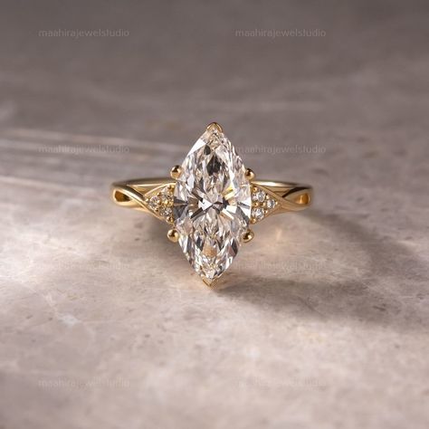 3CT Marquise Cut Lab Grown Diamond Cluster Split Band Engagement Ring, 10K Yellow Gold Unique Anniversary Ring, Promise Ring, Gift For Her  ▶ GEMSTONE DETAILS: ▷ Cut Type: Marquise Cut ▷ Carat weight: 3.02 CT ▷ Color Grade: G ▷ Clarity: VS1 ▷ Cut Grade: Excellent/Ideal ▷ Polish: Excellent ▷ Symmetry: Excellent ▷ Hardness: 10/10 ▷ Type: Lab-Grown Diamond (TYPE 2A/CVD) ▷ Certification: IGI/GIA ▶ SIDESTONE DETAILS: ▷ Cut Type: Round Cut ▷ Carat weight: 0.30CT ▶ JEWELRY METAL & OTHER DETAILS: ▷ Meta Unique Marquis Engagement Rings, Wedding Ring Marquise Gold, Marquis Yellow Gold Engagement Ring, Vintage Pear Engagement Ring Gold, Engagement Marquise Rings, Marquise Engagement Ring Platinum, 4ct Marquise Engagement Ring, Wedding Rings Engagement Marquise, Marquee Cut Engagement Ring