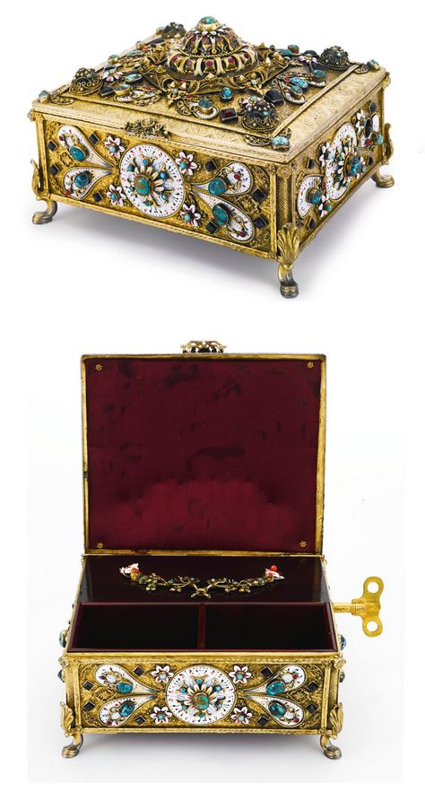 A HUNGARIAN SILVER-GILT, ENAMEL AND GEM-SET MUSICAL JEWELRY BOX, EARLY 20TH CENTURY, rectangular, raised on four scroll feet, applied with shaped enameled panels and flowerheads, set with openwork bosses mounted with jewels, all on matted and chased foliate ground, compartmented interior with music section applied with enamel flower spray, has key apparently unmarked, length 7 1/2 in. 19cm Antique Music Box, Music Box Vintage, Musical Jewelry Box, Antique Jewelry Box, Musical Box, Musical Jewelry, Music Box Jewelry, Music Jewelry, Music Boxes