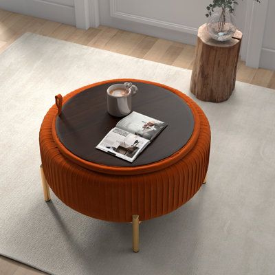 If you are looking for a versatile and functional piece of furniture to add to your home, look no further than this round ottoman. One of the great features of a round ottoman is the storage space it provides. The storage compartment is hidden underneath the cover, providing ample space to store blankets, pillows, and other items that you want to keep out of sight. This makes it a great solution for small spaces where storage is limited. And it can be easily moved around and placed in different Couch And Ottoman Ideas, Round Storage Ottoman, Living Ro, Velvet Ottoman, Round Storage, Round Ottoman, Decorating Inspiration, Upholstered Storage, Inspired Living