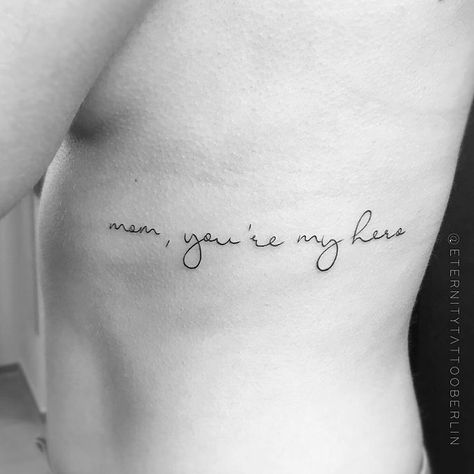 small tattoos on Instagram: ““mom, you’re my hero”  Tattoo artist: @eternitytattooberlin” Quotes For Mom Tattoo, Strong Mom Tattoo Ideas, Mom Birthday Tattoo, Tato Mom, My Hero Tattoo, My Mom Tattoo, Tattoos Dedicated To Mom, Tattoos To Honor Mom, Tattoo Sayings