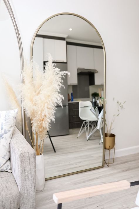 Big Mirror On Wall, Big Mirror In Living Room, Minimalistic Apartment, Arch Mirrors, Big Mirrors, Mirror Bedroom Decor, Simple Bedroom Decor, Simple Living Room Decor, Living Room Dining Room Combo