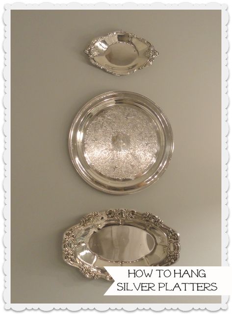 A quick and easy way to hang lightweight silver platters on the wall, without using a wire plate hanger.  3M Command Hooks and a twist tie provide an invisible hook to hang these on the wall.  How to's at 11 Magnolia Lane.  Too easy! Silver Plates, Silver Display, Silver Platters, Plate Hangers, Silver Trays, Silver Decor, How To Hang, Silver Pieces, Household Hacks