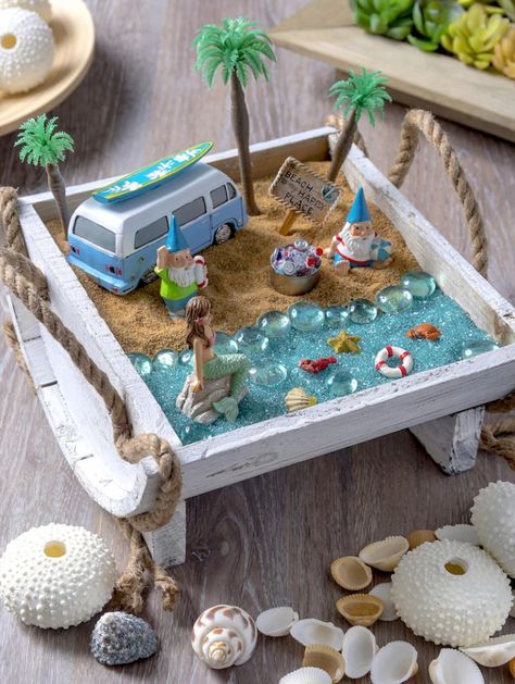 Create your own beach fairy garden and bring a sense of seaside enchantment to your home or outdoor space. It's so easy to put together! Miniature Beach Scene, Fairy Garden Design Ideas, Beach Fairy Garden, Fairy Garden Designs, Fairy Garden Crafts, Mini Fairy Garden, Faeries Gardens, Fairy Garden Houses, Garden Design Ideas