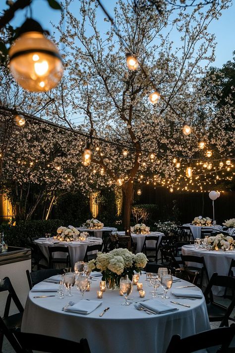 Enchanting outdoor wedding setup with soft string lights and floral decor. Get enchanted by wedding decor ideas that remain elegant across the ages while impressing even the pickiest Aunt Mildred. Wedding Setup Ideas Outdoor, Classy Backyard Wedding Reception, Indoor Outdoor Wedding Reception, Elegant Backyard Wedding Reception, Classy Backyard Wedding, Outdoor Wedding Setup, Elegant Outdoor Wedding Reception, Timeless Wedding Decor, Elegant Backyard Wedding