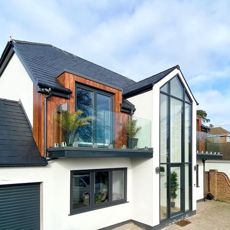 The owners have taken a small dated bungalow and added on a double storey, turning it into an impressive family home. We love the combination of the white render and the cladding. The large glass door is the most amazing feature and allows so much light into this home. Amazing double storey extension by @behind_the_glass_door on Instagram. House Extension Ideas, Small House Extensions, Bungalow Conversion, Dormer Bungalow, Bungalow Extensions, Modern Bungalow Exterior, House Extension Plans, Exterior House Remodel, Self Build Houses