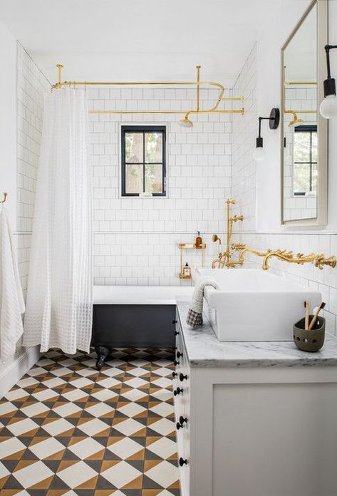 A bold tile in a fun pattern can often make the other parts of a space pop - like the brass and black accents of this bathroom! + freestanding tub + brass faucet + wall mount faucet + ceiling mounted shower curtain rod | Design by Anderson Wier Studio Kids Bathrooms, Style Me Pretty Living, Elegant Living Room Decor, The World Of Interiors, Freestanding Tub, Tub Shower, Clawfoot Tub, Boutique Design, Kids' Bathroom