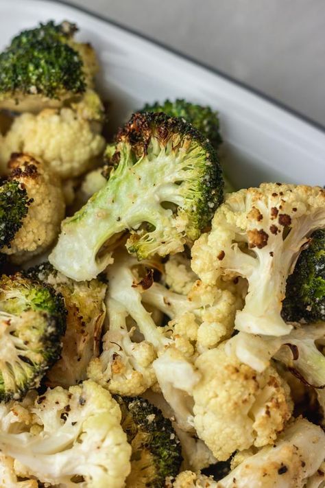 This roasted broccoli and Cauliflower recipe with parmesan is about to be the best way you eat these two vegetables. Broccoli and cauliflower tossed together in the best vegetable marinade and roasted to perfection until crispy on the edges and tender to bite on the inside.  it is so simple to make yet delicious and healthy. A perfect healthy side dish to many other main dishes. Let me show you how to roast broccoli and cauliflower you will love and make over and over again. Baked Broccoli And Cauliflower, Broccoli And Cauliflower In Oven, Roasted Broccoli And Cauliflower, Broccoli And Cauliflower Recipes, Roast Cauliflower And Broccoli, Roasting Frozen Cauliflower In Oven, Roasted Brocolli And Cauliflower Recipes, Frozen Broccoli Cauliflower And Carrots Recipe, Best Roasted Vegetables