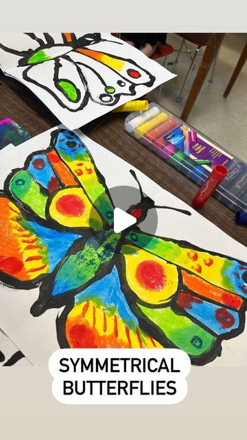 Savanna🎨 on Instagram: "Symmetrical butterflies with kindergarten! This was a fun one that the kiddos loved- and it gave them some knowledge of life cycles, symmetry, paint skills, patterns and colors in nature, and much more!   #artforkids #artwithkids #kindergartenart #artistsatwork #workinprogress #elementaryart #elementaryartclass #elementaryartteachers #elementaryteacher #artteachers #artteacher #artteachersofinstagram #artteacherlife #animalart #shading #texture #animaldrawing #realisticdrawing #artworkoninstagram #artworkoftheday #butterflyart #butterflies #kinder  #artlesson #elementaryartlesson #springart" Symmetrical Butterfly Art For Kids, Butterfly Symmetry Painting, Symmetry Art Projects, Symmetry Art For Kids, Butterfly Art For Kids, Butterfly Cycle, Symmetrical Butterfly, Colors In Nature, Symmetrical Art