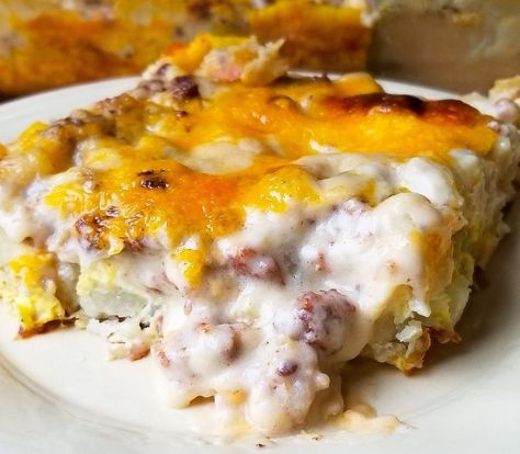 SAUSAGE GRAVY BREAKFAST CASSEROLE; a layered casserole of eggs, hash brown style potatoes, cheese, and sausage gravy; hits the spot every time! (A.K.A. HANGOVER CASSEROLE) Sausage Gravy Breakfast Casserole, Casserole With Hashbrowns, Sausage Gravy Breakfast, Breakfast Casserole With Hashbrowns, Gravy Breakfast Casserole, Veggie Breakfast Casserole, Sweet Breakfast Casserole, Vegetarian Breakfast Casserole, Breakfast Casserole French Toast