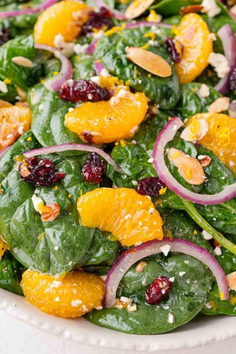 Sweet combines with savory to create this colorful mandarin orange salad. You’ll love the mixture of textures and flavors, and it’s easy to scale up for a party—which is good because it’s definitely a crowd-pleaser! Orange Pecan Salad, Green Salad With Oranges, Salad With Tangerines, Mandarin Spinach Salad, Salad With Mandarin Oranges And Almonds, Green Salad With Mandarin Oranges, Asian Salad Mandarin Oranges, Salad Recipes With Oranges, Asian Mandarin Orange Salad