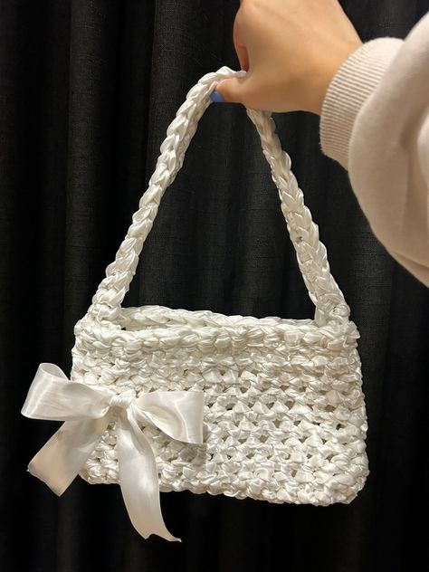 Learn how to crochet a stylish and practical ribbon bag with this easy step-by-step tutorial. This project is perfect for beginners and experienced crocheters Crochet Ribbon Bag, Crochet Bag White, White Crochet Bag, Ribbon Crochet, Silk Crochet, Crochet Ribbon, Ribbon Bag, Crochet Bracelet Pattern, Beginner Crochet Tutorial